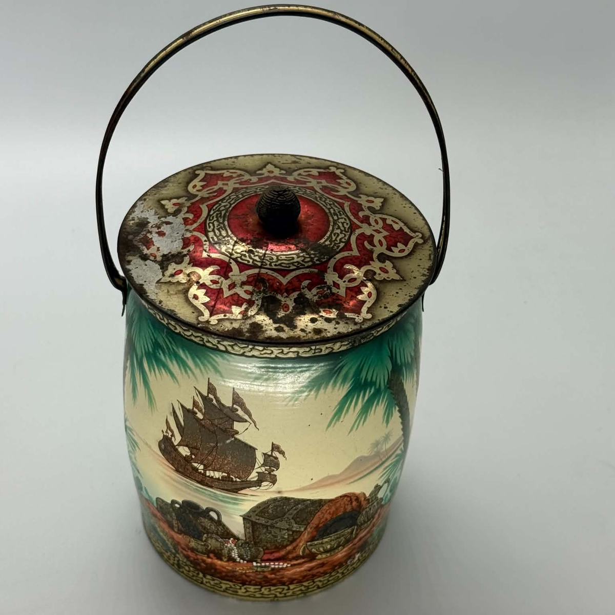 Vintage treasure island biscuit tin or sweet tin with pirate artwork all over