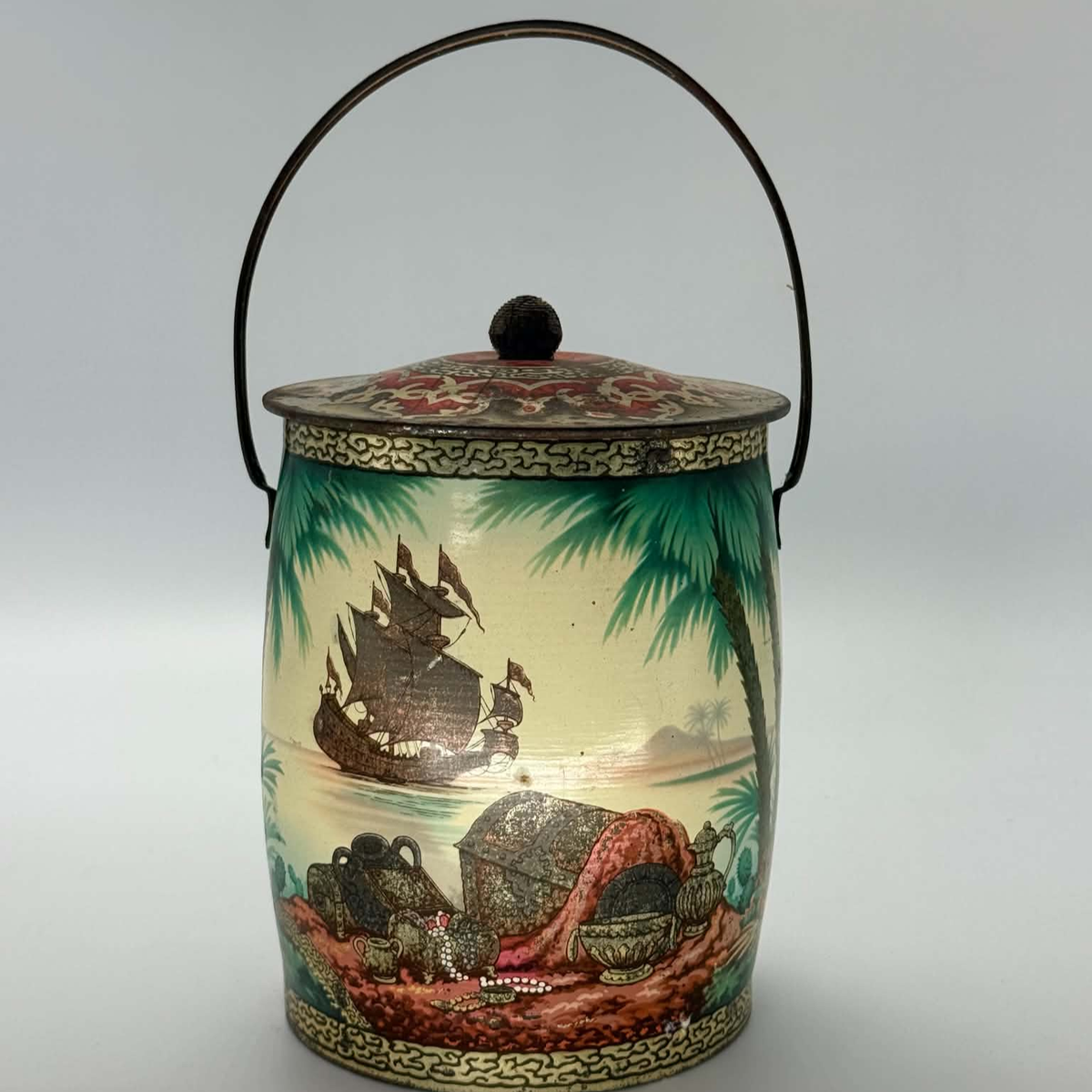 Vintage treasure island biscuit tin or sweet tin with pirate artwork all over