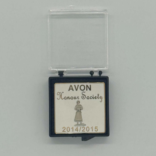 A small square black plaque with a clear plastic cover lid, featuring a cream-colored front label that reads 'AVON Honour Society 2014/2015' with an illustration of a robed figure. The plaque is photographed on a plain light gray background.